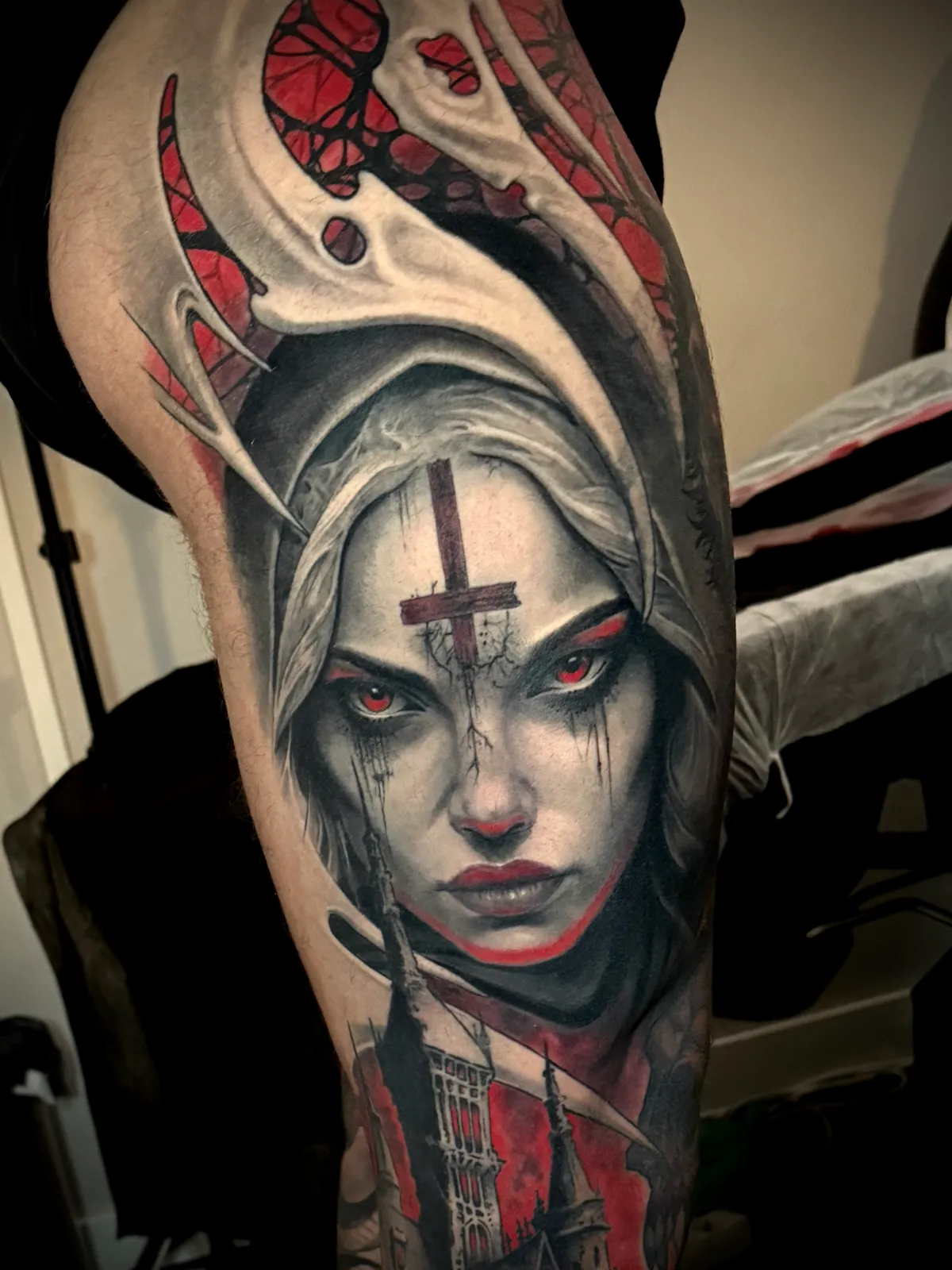Dark art gothic nun portrait with red accent eyes and cross detail close-up tattoo by Paul Michael Andras