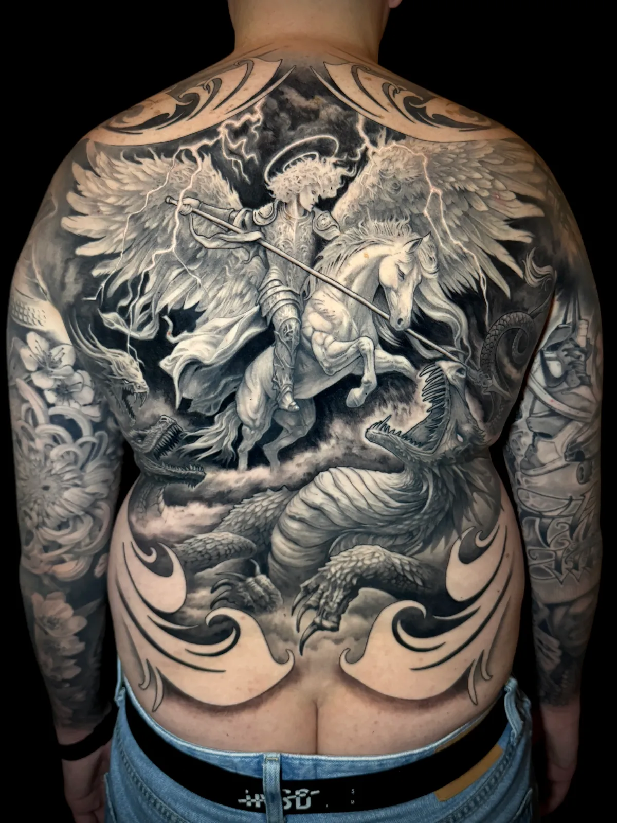 Black and grey realism archangel on horseback slaying dragon epic full back piece tattoo by Andras Tattoo